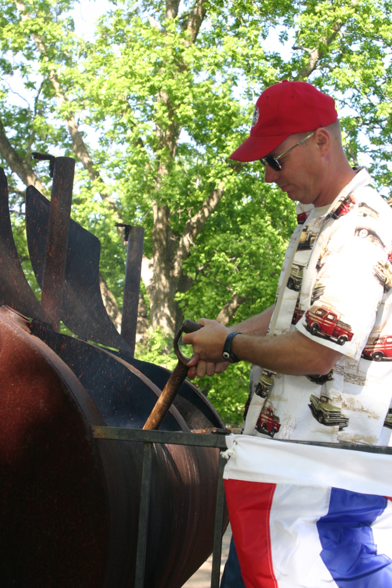 Staff Sergeant Mack G. Lord, 307th Red Horse Squardron, pavement and equipment operator, helps prepare lunch during a welcome home celebration for members of the 307 RHS returning from duty in Iraq. Over 300 friends and family attended the event at Mike Woods Park, Saturday, May 3, 2008. (US Air Force photo/Tech. Sgt. Jeffrey S. Walston)