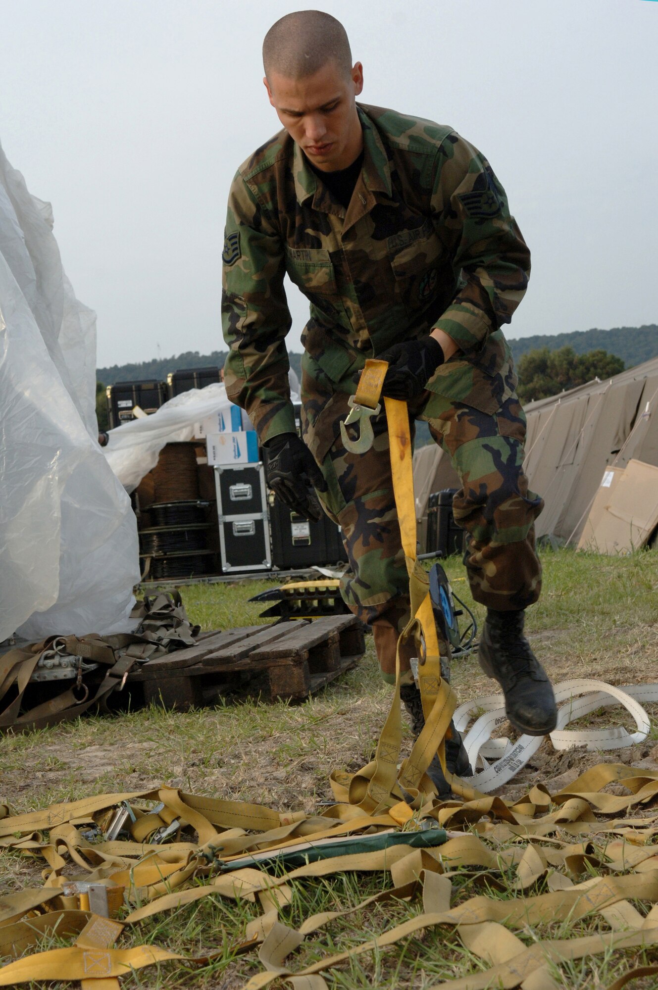 LORA NAVAL STATION, SPLIT, Croatia (April 29, 2008) - U.S. Air Force Staff Sgt. Jason Martin, data technician supervisor, 1st Combat Communications Squadron from Ramstein Air Base, Germany, untangles a cargo net while preparing a palette for transport during the set up for exercise Combined Endeavor, Lora Naval Station, Croatia, April 29. More than 40 participating nations use Combined Endeavor to plan, prepare and practice using a full range of communications equipment, policies, and procedures prior to deploying for NATO missions and emerging, real world situations such as the evacuation of Lebanon and response to natural disasters. (U.S. EUCOM photo by U.S. Air Force Airman 1st Class Kelly LeGuillon) (RELEASED)