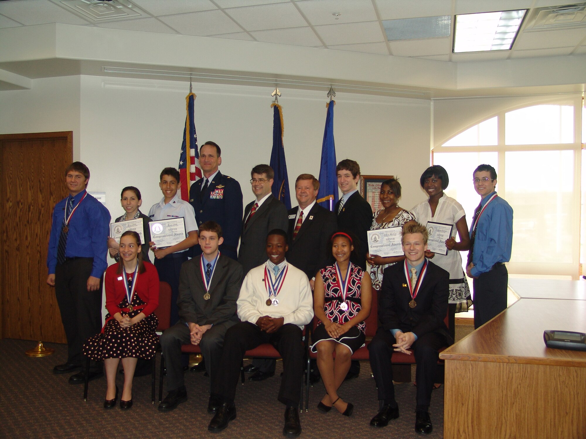 Front Row (left to right) Laura Van Epps, Colin Sorensen, Wayne Banks, Tonni Blount and Matthew Armistead. Back Row (left to right) Matthew Bashus, Lisa Zilli, Tony Zilli, 55th Wing Commander Brig. Gen. James Jones, Congressman Lee Terry, Dr. John Deegan, Bellevue Superintendent of Schools Edward Hanline, Erica McCoy, LauRen Gaines and Joseph Wier. (Courtesy Photo)                               