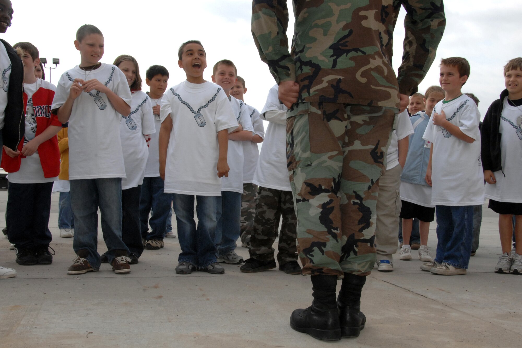 Staff Sgt. Chad Cullins, fuels POL from the Maintenance Squadron, demonstrates facing movements for students as part of the 2008 Kids PDF mock deployment hosted here, May 1. (U.S. Air Force Photo By/Josh Plueger)  