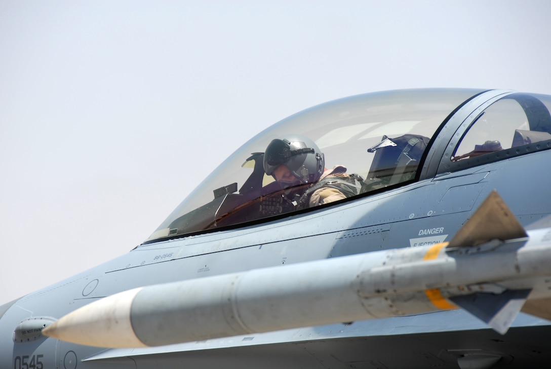 F-16 Fighting Falcon pilot, Major Keith Kelly preflihgts his aircraft prior to a combat mission at Balad Air Base, Iraq. Major Kelly, from the 180th Fighter Wing, Ohio is currently assigned to the 332nd Air Expeditionary Wing in support of Operation Iraqi Freedom. USAF Photo by TSgt Beth Holliker (Released).