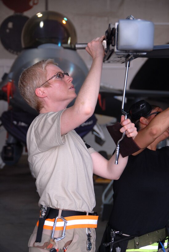 Weapons Loader, Technical Sergeant Rebecca Daur, Ohio Air Natioal Guard prepares to load an Advanced Mediaum Range Air to Air Missile on F-16 Fighting Falcon at Balad AIr Base, Iraq. USAF Photo by TSgt Beth Holliker (Released).