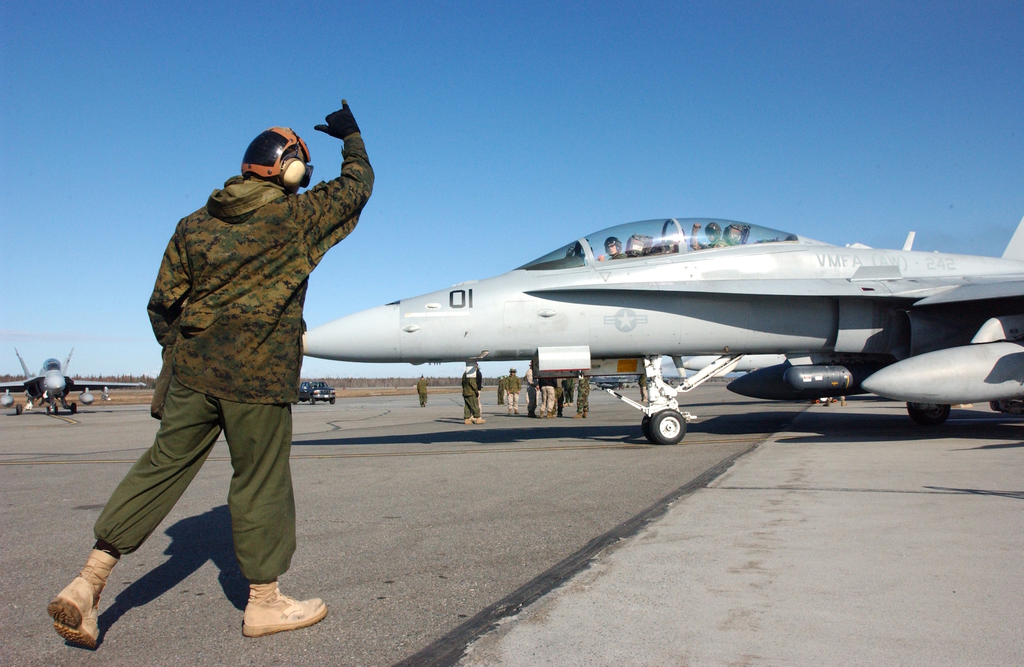 EIELSON AIR FORCE BASE, Alaska --  Lance Cpl. Alantheus Thompson, a plane captain with Marine Attack Squadron 242, tells his commanding officer to ‘Hang Loose’ before launching an F/A-18 on a training mission during Northern Edge ‘08 at Eielson AFB in Fairbanks, Alaska. VMFA (AW) 242 traveled from Iwakuni, Japan to participate in the two-week joint training exercise. Photo by Marine Sgt. Rocky Smith