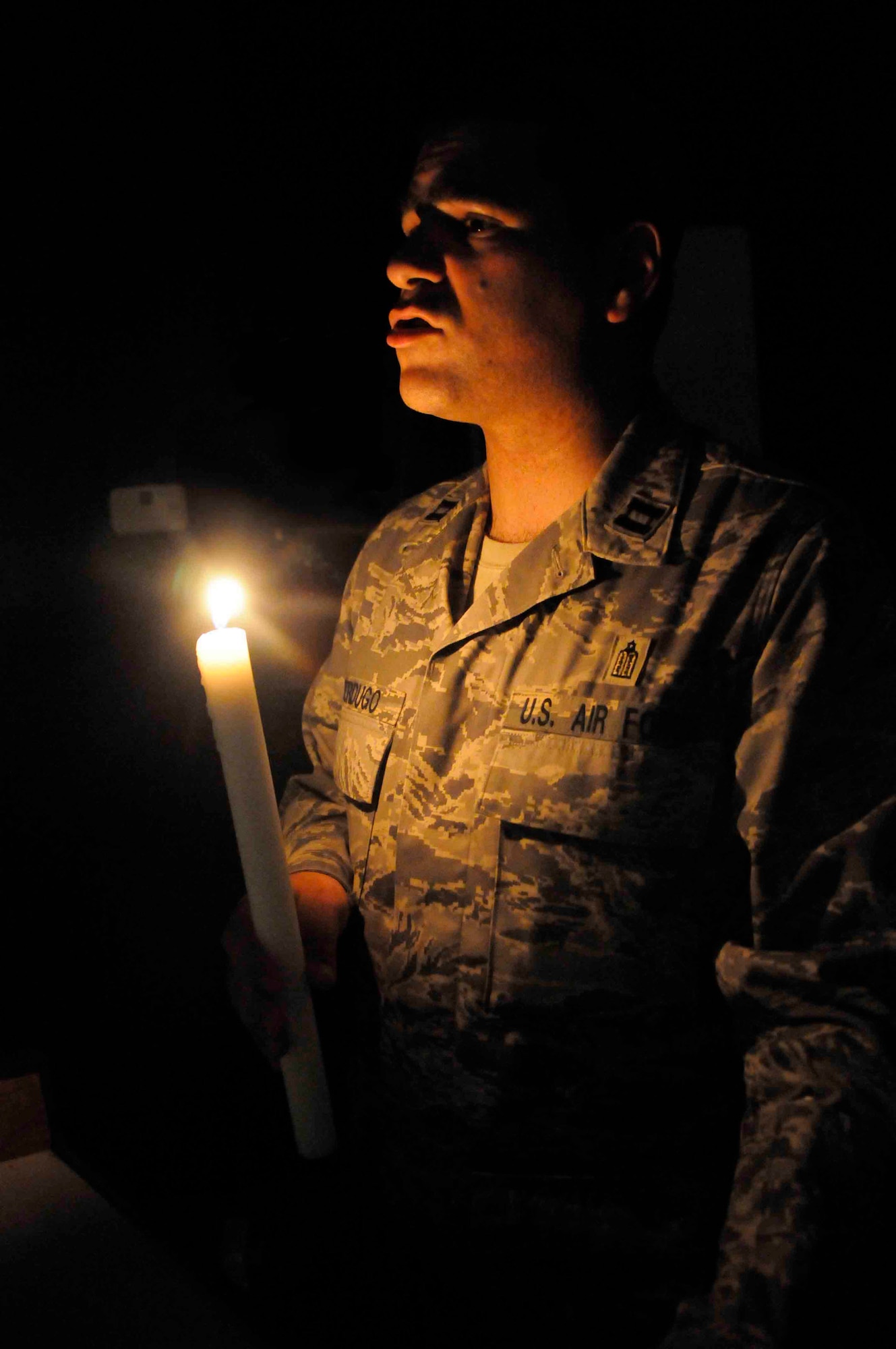 Rabbi (Capt.) Raphael Berdugo leads a prayer in Yiddish for more than 30 members May 2 at a Southwest Asian air base. The 15th-generation rabbi is one of nine Jewish religious leaders in the Air Force and the only one currently deployed to Southwest Asia. Rabbi Berdugo is the 379th Air Expeditionary Wing chaplain deployed from McGuire Air Force Base, N.J. (U.S. Air Force photo/Senior Airman Domonique Simmons) 
