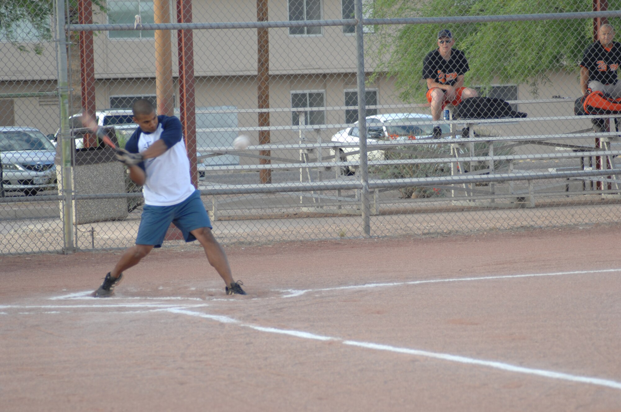 Michael Torres, FWCONS outfielder, crushes the ball in the first inning of the FWCONS vs. ECS intramural softball game May 6. FWCONS won the game 19-4.  