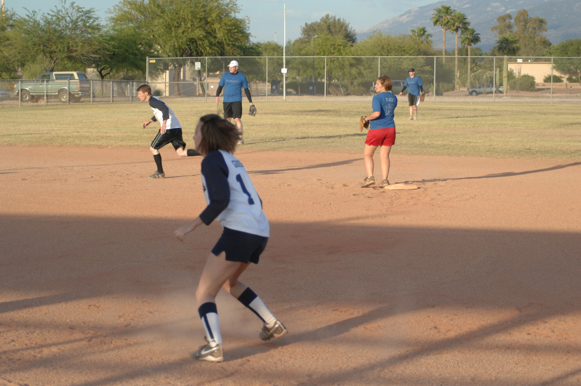 Alesia "Goose" Goosic, FWCONS catcher, prepares to run to second base in the second inning of the FWCONS vs. ECS intramural softball game May 6. FWCONS won the game 19-4.  