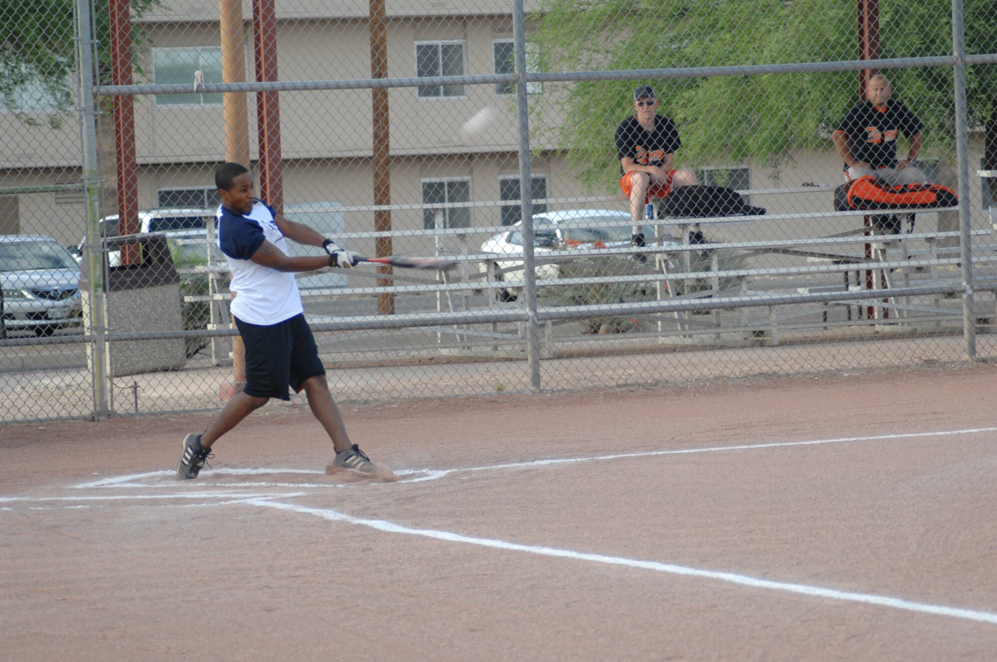 Curtis Alexander, FWCONS outfielder, bloops a single off ECS in the first inning of the FWCONS vs. ECS intramural softball game May 6. FWCONS won the game 19-4. 