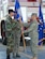 Lt. Col. Anthony C. Butts takes the 612th Air Base Squadron guidon from Col. Mark W. Mouw, 612th Theater Operations Group commander, during a change of command ceremony May 7 at Soto Cano Air Base, Honduras. The former 612th ABS commander, Lt. Col. Randall L. Vogel, moves to his new assignement as 55th Operations Group deputy commander, Offutt Air Force Base, Neb. The 612th ABS provides a 24-hour, all weather C-5 capable airfield, base operations support, air traffic control, weather, crash fire rescue, logistics and base civil engineers to support theater-wide United States Southern Command operations. (U.S. Air Force photo by Tech. Sgt. John Asselin)