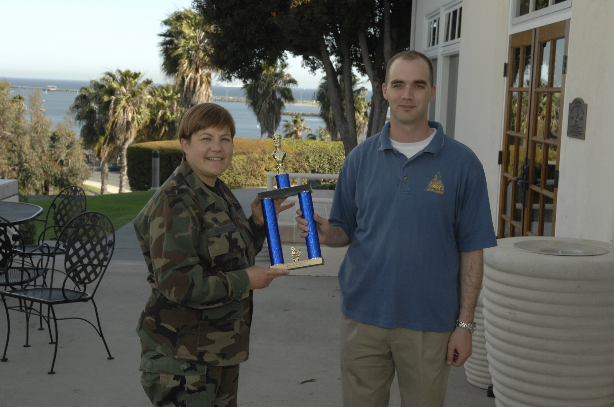 Tech. Sgt. Robert Bucholtz accepts the AFSPC’s MAJCOM Chess Tournament’s second place trophy from Col. Nannette Benitez, 61 MSG Commander. He advances to the Air Force Chess Championship, May 5-8. (Photo by Stephen Schester)
