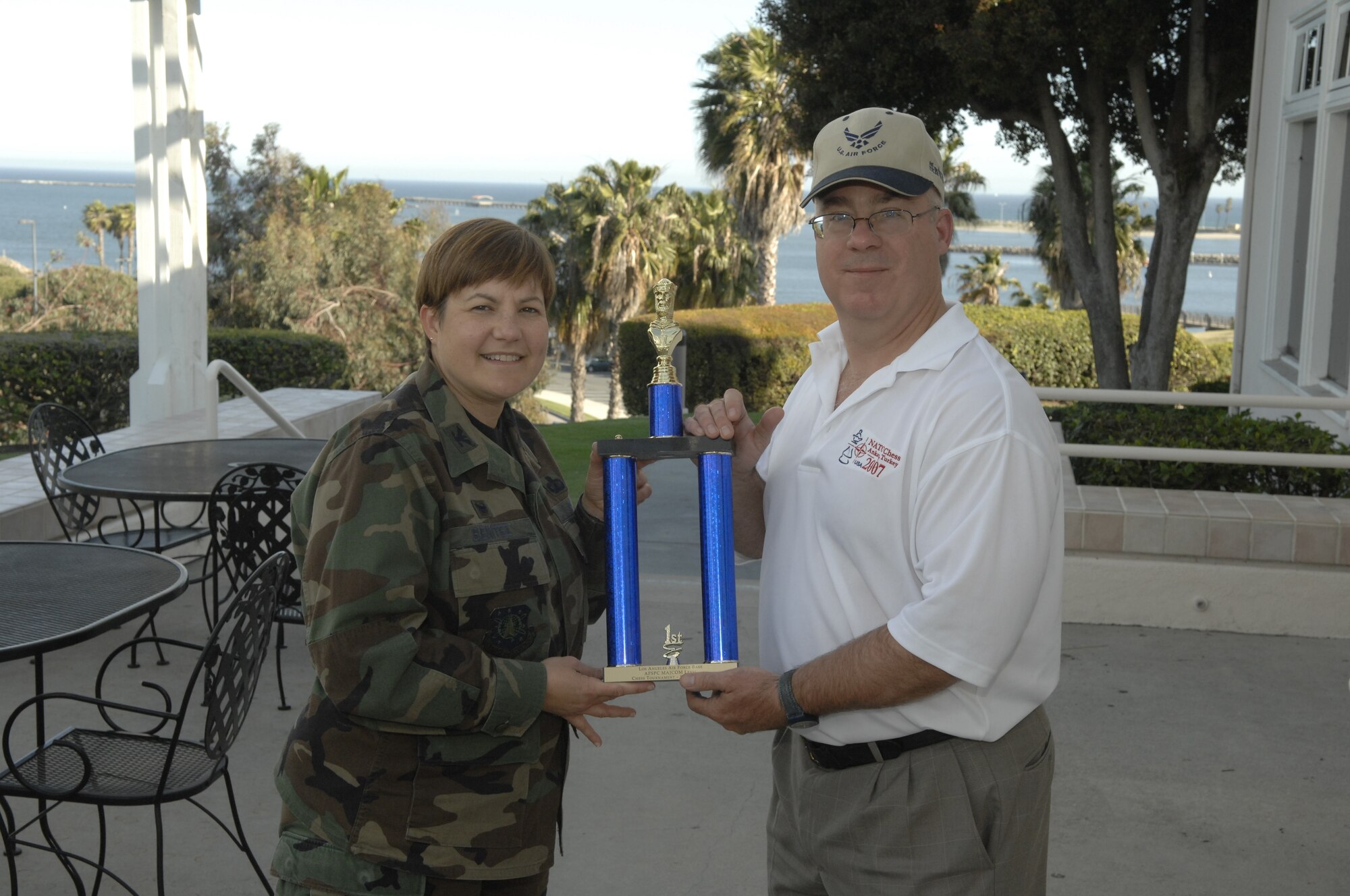Lt. Col. Douglas Taffinder accepts the AFSPC’s MAJCOM Chess Tournament’s first place trophy from Col. Nannette Benitez, 61 MSG Commander.  Lt. Col. Taffinder is the 2007 Inter-Service Chess Champion.  He advances to the Air Force Chess Championship, May 5-8. (Photo by Stephen Schester)