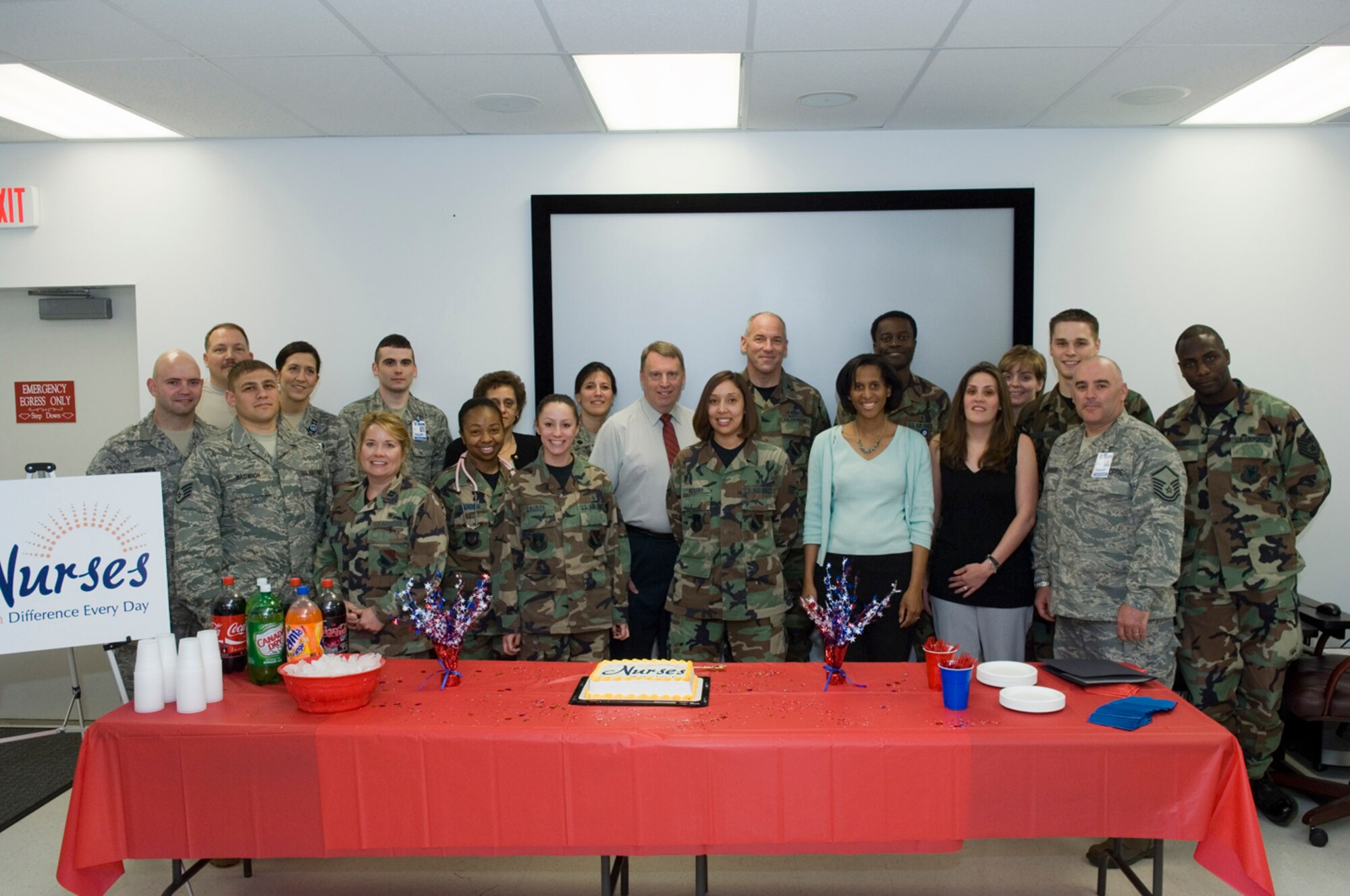 HANSCOM AFB, Mass. - Col. Tom Schluckebier, 66th Air Base Wing commander, joins 66th Medical Group nurses and technicians on May 6 in celebrating, National RN Recognition Day and National Nurses, Technicians week, which takes place annually May 6 to12. 

Colonel Schluckebier honored the dedication, commitment, and tireless efforts of the nurses and technicians at the 66 MDG and signed a proclamation declaring May 6 to 12, National Nurses and Technicians week here at Hanscom.  (U.S. Air Force Photo by Rick Berry)
