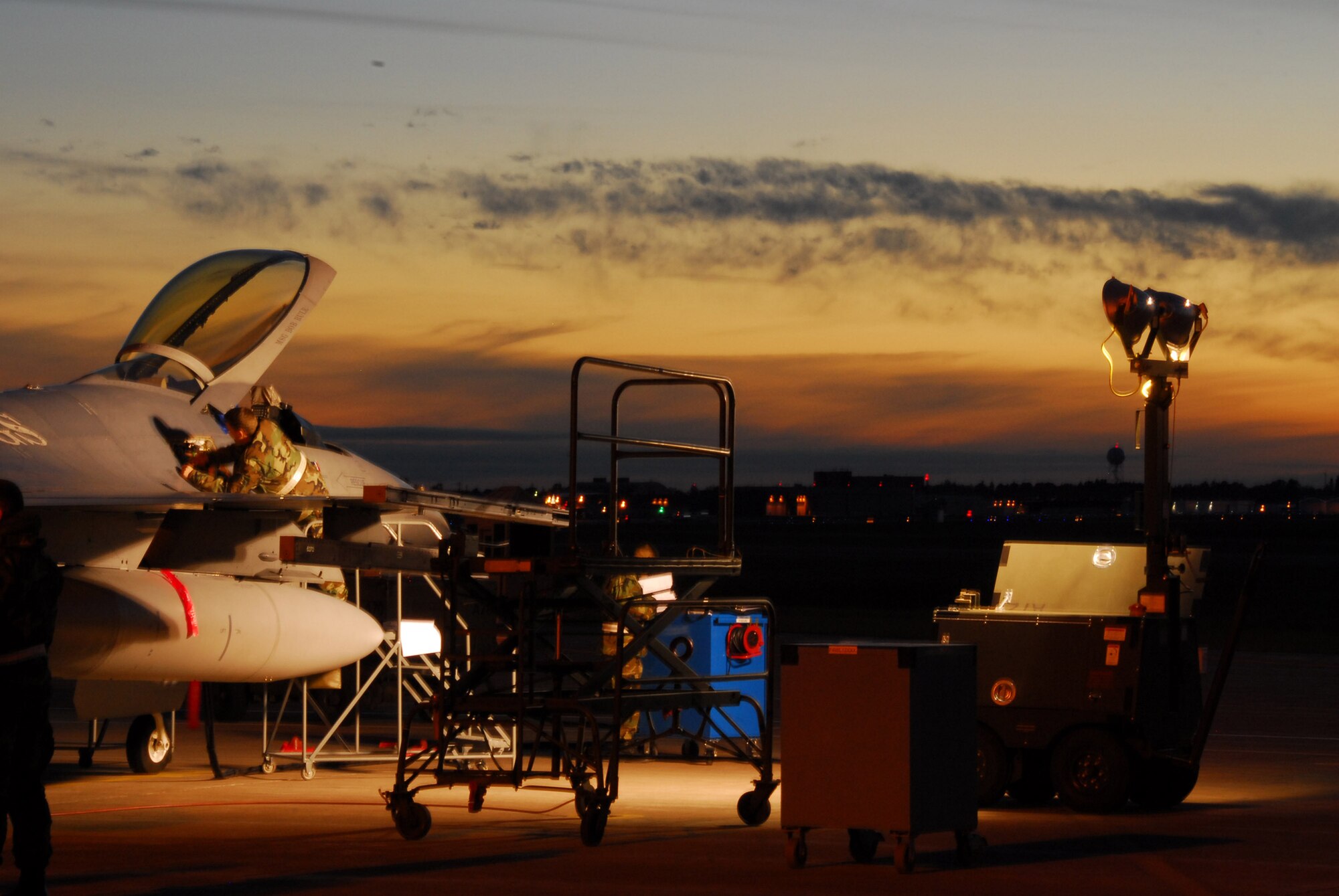 A member of the 148th Fighter Wing works on an F-16 Fighting Falcon during an October 2007 Operational Readiness Exercise in Duluth, Minn. The 148th FW was selected by Occupational Health and Safety Administration officials for the Voluntary Protection Program Star Award. (U.S. Air Force photo/Staff Sgt. Don Action)
