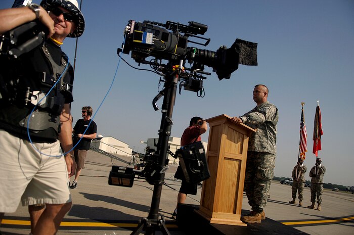 Master Sgt. Christopher Nolan plays the part of a chaplain during the filming of the Lifetime TV drama, "Army Wives," on the Charleston AFB flightline May 5. Sergeant Nolan is a combat correspondent with the 1st Combat Camera Squadron. (U.S. Air Force photo/Senior Airman Nicholas Pilch)