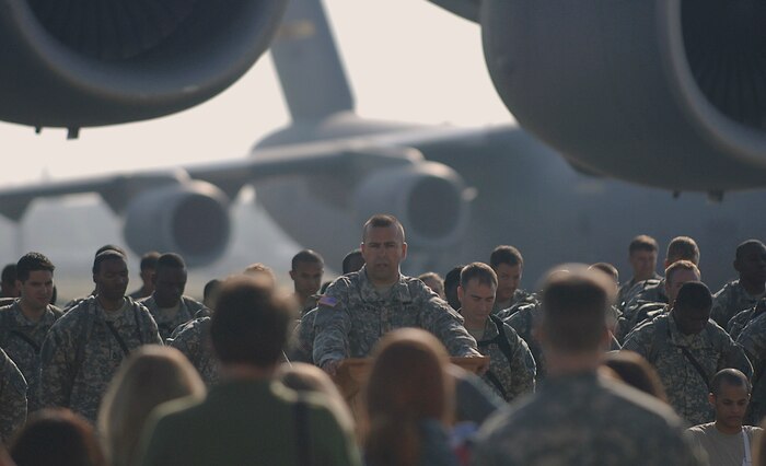 Master Sgt. Christopher Nolan plays the part of a chaplain during the filming of the Lifetime TV drama, "Army Wives," on the Charleston AFB flightline May 5. Sergeant Nolan is a combat correspondent with the 1st Combat Camera Squadron. (U.S. Air Force photo/Senior Airman Nicholas Pilch)