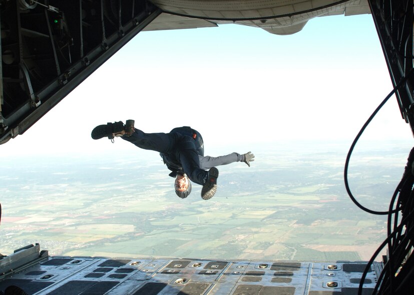 DYESS AIR FORCE BASE, Texas -- A Wings of Blue team member jumps out of a Dyess C-130 head first, May 2. The Air Force Academy's Wings of Blue opened the ceremonies for Rockin' in the Park. The show was a way to thank Team Dyess members and welcome airshow crew to Dyess. (U.S. Air Force Photo by Airman 1st Class Micheal Breaux) 