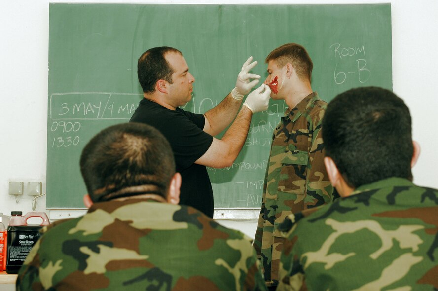 Tech. Sgt. Stephen DeReis demonstrates the application of moulage on Cadet Abbasov Maksim May 3 for cadets from the Military Medicine Faculty of the Azerbaijan Medical University during the 2008 Medical Training Exercise in Central and Eastern Europe. MEDCEUR is a Joint Chiefs of Staff regional/multilateral exercise sponsored by U.S. European Command. Croatia is hosting the 2008 exercise which has drawn about 400 multi-nationals in support of the Partnership for Peace initiative. Sergeant DeReis is with the 458th Expeditionary Medical Squadron. (U.S. Air Force photo/Staff Sgt. Kristin Ruleau) 