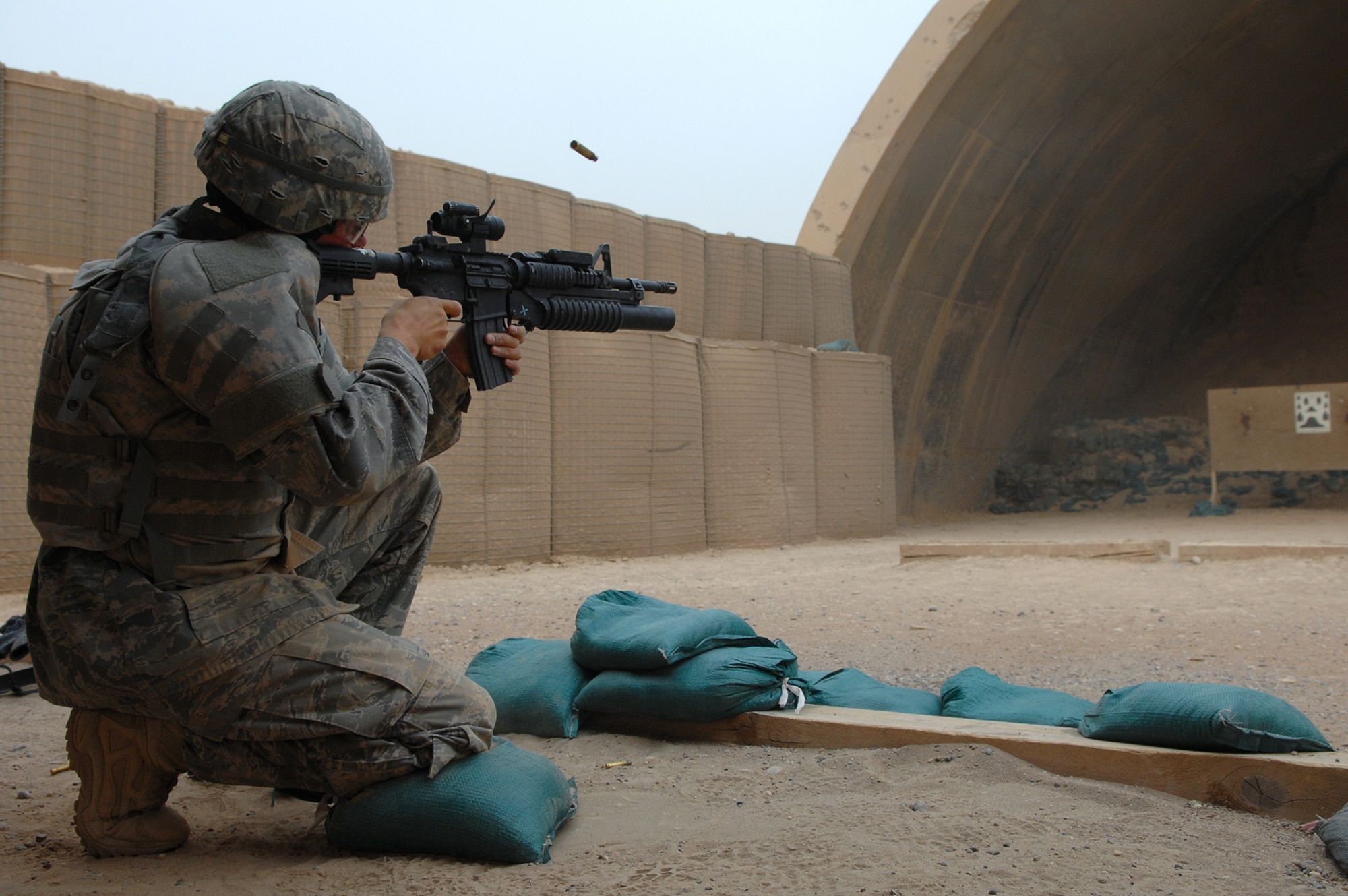 BALAD AIR BASE, Iraq -- Airman 1st Class Darryl Worthey, 332nd Expeditionary Security Forces Squadron security forces, shoots an M-4 at a silhouette target that simulates various distances here, April 30. By being completely comfortable and familiar with a weapon reaction time during an emergency situation is more timely. Airman Worthey is deployed from Mountain Home Air Force Base, Idaho. (U.S. Air Force photo/ Senior Airman Julianne Showalter)