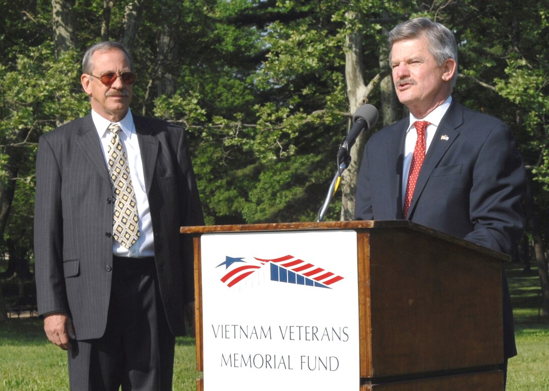James Nicholson, former secretary of Veteran Affairs, speaks to the press about the Vietnam Veterans Memorial before the ceremony, May 7, 2008, Washington, D.C. Jan C. Scruggs, left,  founder and president of the Vietnam Veterans Memorial Fund, looks on.