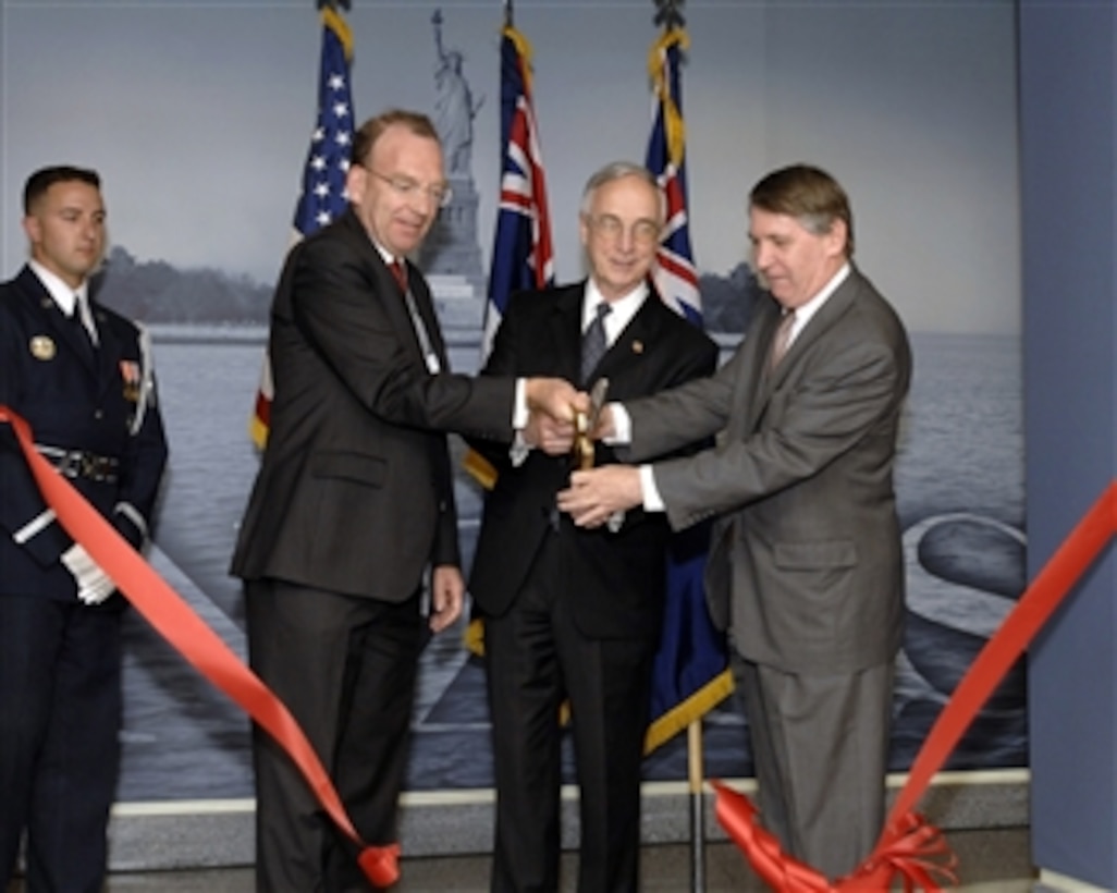 Deputy Secretary of Defense Gordon England (center), New Zealand Ambassador to the United States Roy Ferguson (left) and Australian Ambassador Dennis Richardson (right) jointly cut the ribbon formally dedicating the newly redesigned ANZUS Corridor in the Pentagon on May 6, 2008.  The corridor's exhibits celebrate the long-standing defense partnership existing between the three signature nations.  