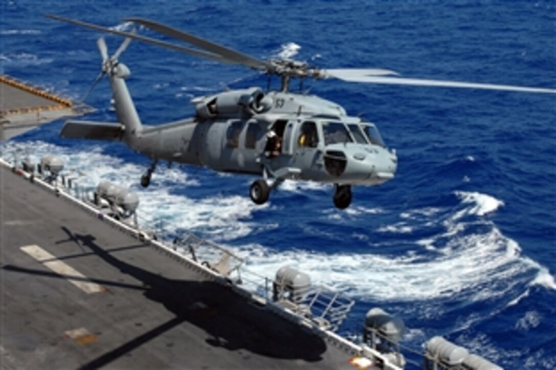 A MH-60S Seahawk helicopter lifts off the flight deck of the amphibious assault ship USS Peleliu in the Pacific Ocean, May 6, 2008. 