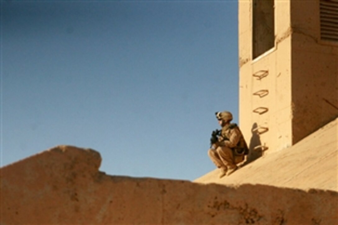 U.S. Marine Lance Cpl. Alec N. Temples provides security while fellow scouts search old bunkers in western Anbar province, Iraq, May 2, 2008. Temples is assigned to Charlie Company, 2nd Light Armored Reconnaissance Battalion, Regimental Combat Team 5.  