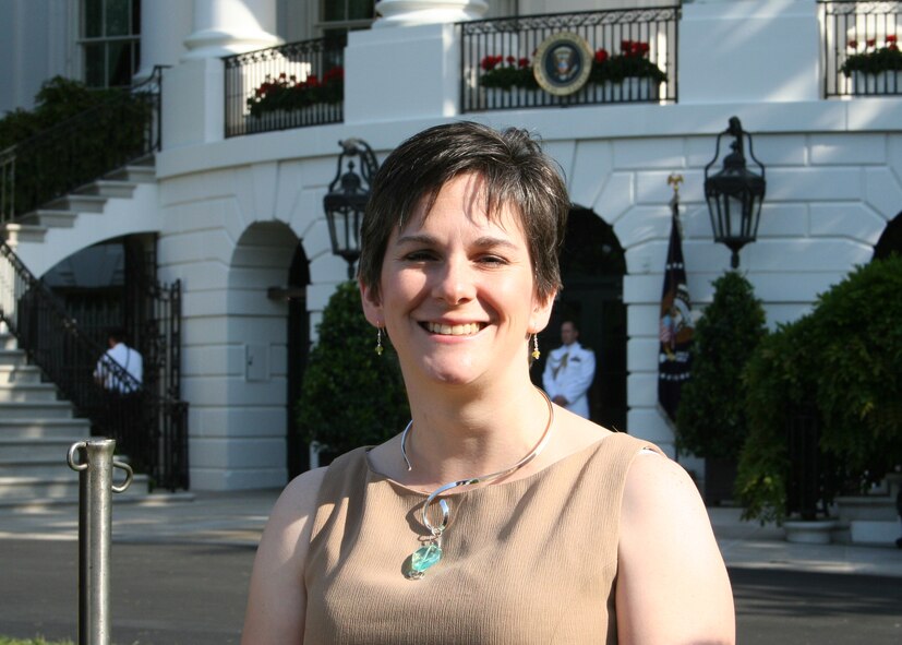 WHITE HOUSE, Washington D.C -- Meighan Altwies wife of Major Aaron Altwies, Deputy Commander of the 8th Civil Engineering Squadron, posed for a photo in front of the White House here May 6.  Mrs. Altwies was invited to attend the Military Spouse Appreciation Breakfast on the south lawn of the White House. This event was held to honor military spouses for their contributions, efforts and support they provide to their spouses whether deployed or at home. (Courtesy photo)  