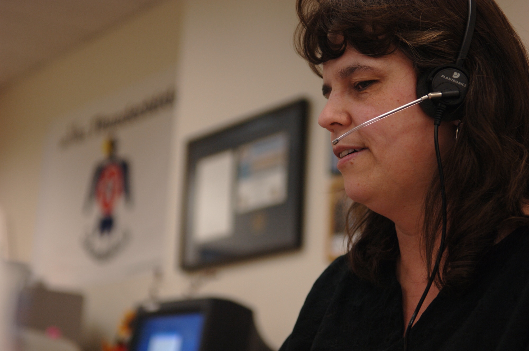 FAIRCHILD AIR FORCE BASE, Wash. – Operator 14 answers an incoming call and patches the caller through to their desired destination here May 7. Operator 14 is the youngest of the operators here, and has been known as Operator 14 for three years. (U.S. Air Force photo / Senior Airman Jocelyn Ford)