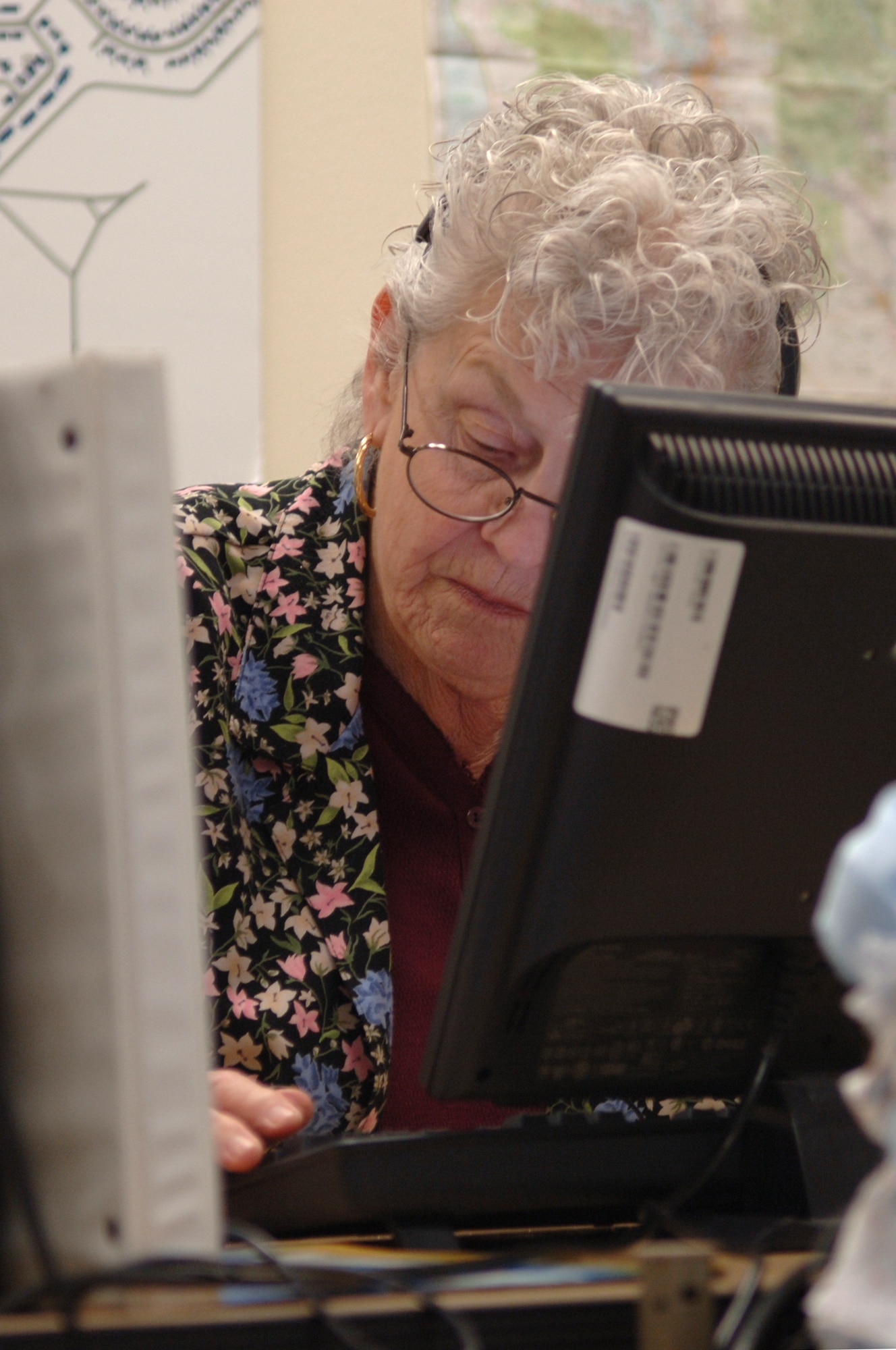 FAIRCHILD AIR FORCE BASE, Wash. – Operator 18 takes an incoming call and connects the caller to their desired number here May 7. Operator 18 has worked as a base operator for four years, and is the oldest operator here. (U.S. Air Force photo / Senior Airman Jocelyn Ford) 