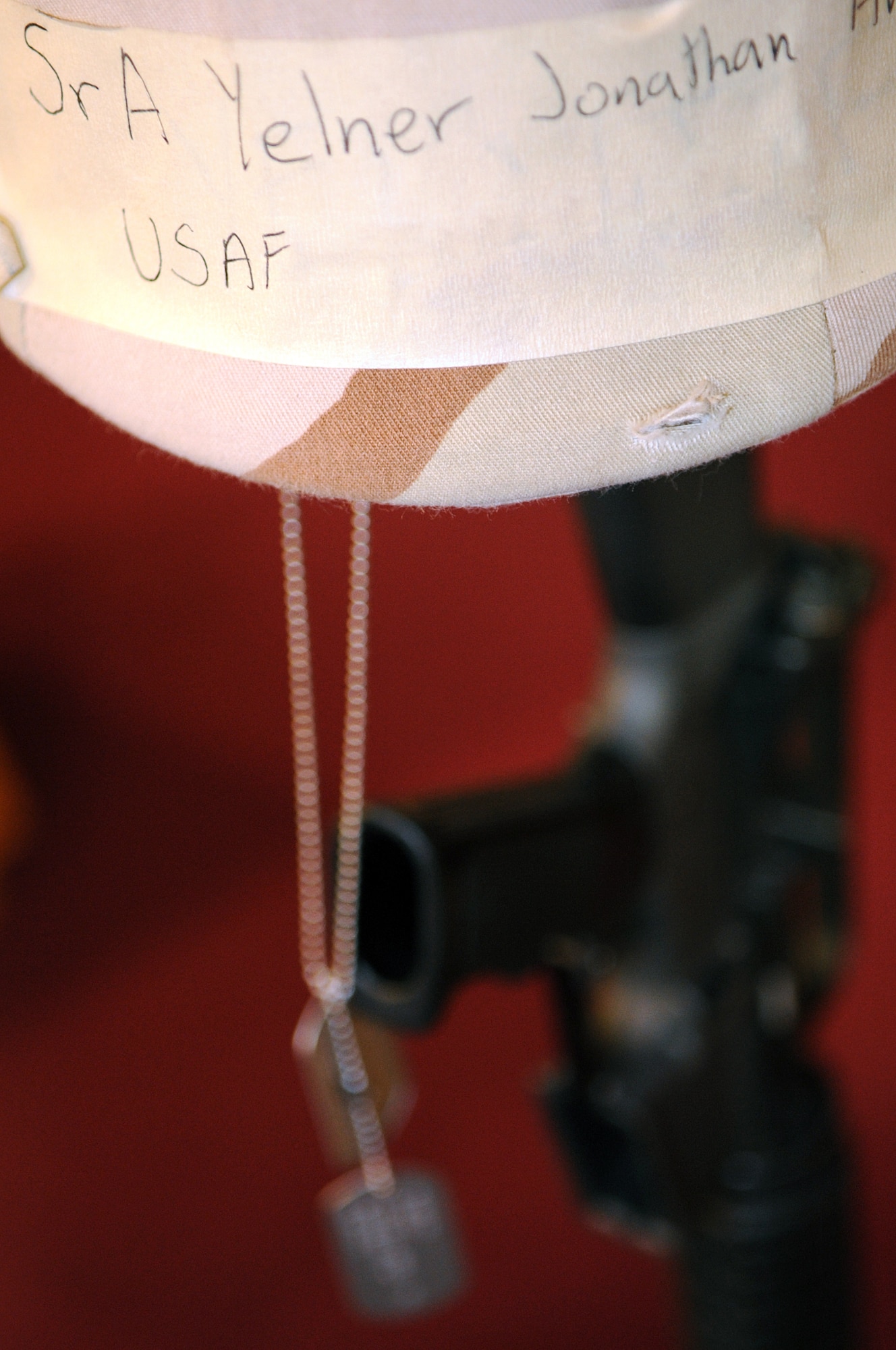 The helmet and dog tags belonging to Senior Airman Jonathan Yelner, 28th Aircraft Maintenance Squadron weapons load crew member, are displayed at his memorial service held here, May 8. Airman Yelner died April 29 near Bagram Air Base, Afghanistan, of wounds inflicted by an improvised explosive device. (U.S. Air Force photo/Senior Airman Marc I. Lane) 