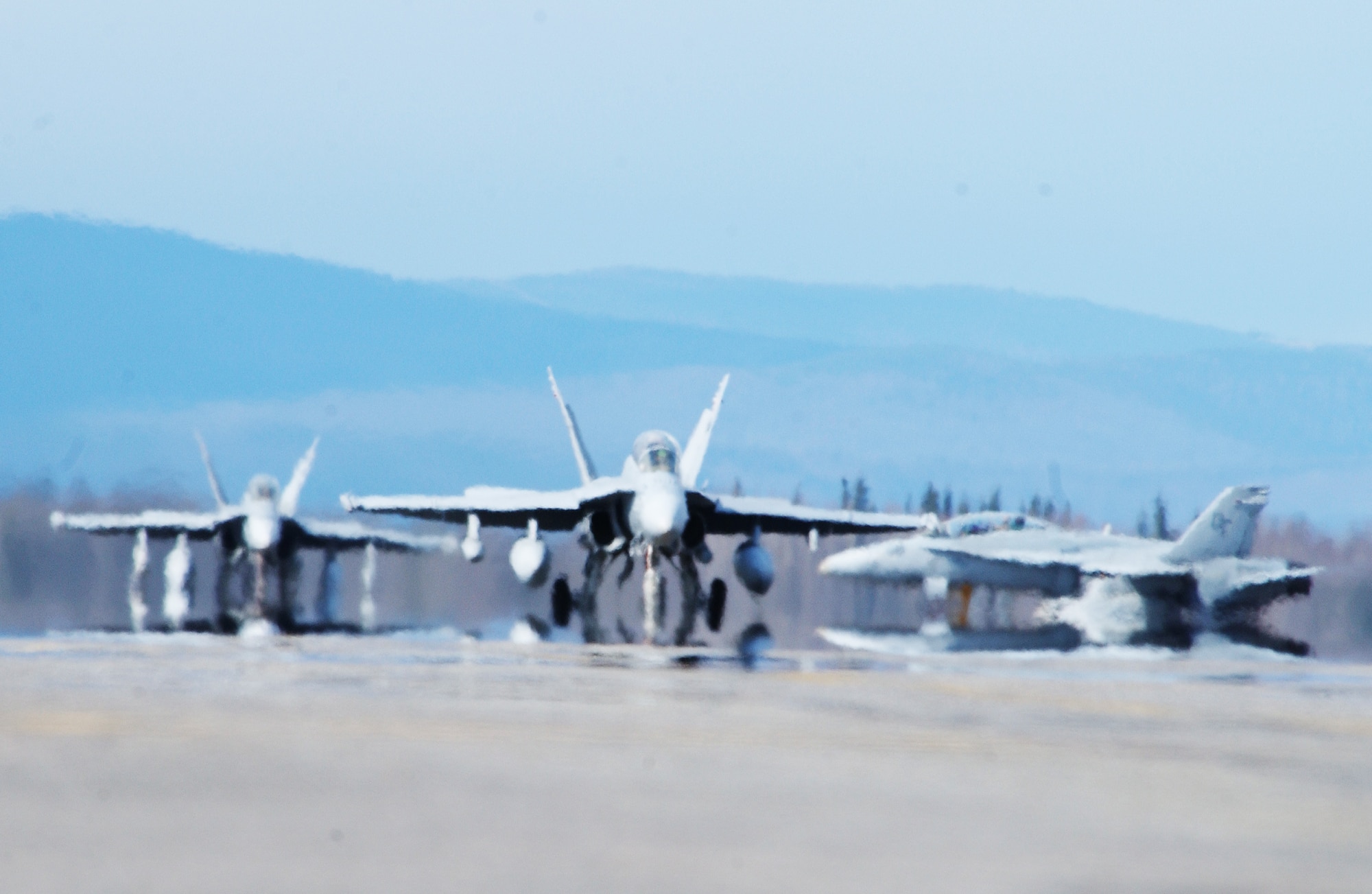 Three Marine F/A-18 Hornets taxi down the flightline prior to take off May 7, 2008, at Eielson Air Force Base, Alaska during Northern Edge 08 exercise. This is a joint training exercise hosted by Alaskan Command and is one of a series of U.S. Pacific Command exercises that prepare joint forces to respond to crises in the Asian Pacific region. (U.S. Air Force Photo/Airman 1st Class Jonathan Snyder)