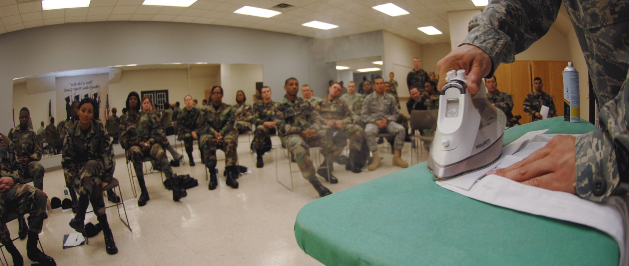 MOODY AIR FORCE BASE, Ga. – Senior Airman Josh Malyemezian, U.S Air Force Honor Guard, demonstrates how to iron an uniform here May 1. The U.S Air Force Honor Guard visited Moody to provide training to Honor Guard members from various bases in an effort to standardize the Honor Guard program in the Air Force. (U.S. Air Force photo by Senior Airman Angelita Lawrence) (Released)