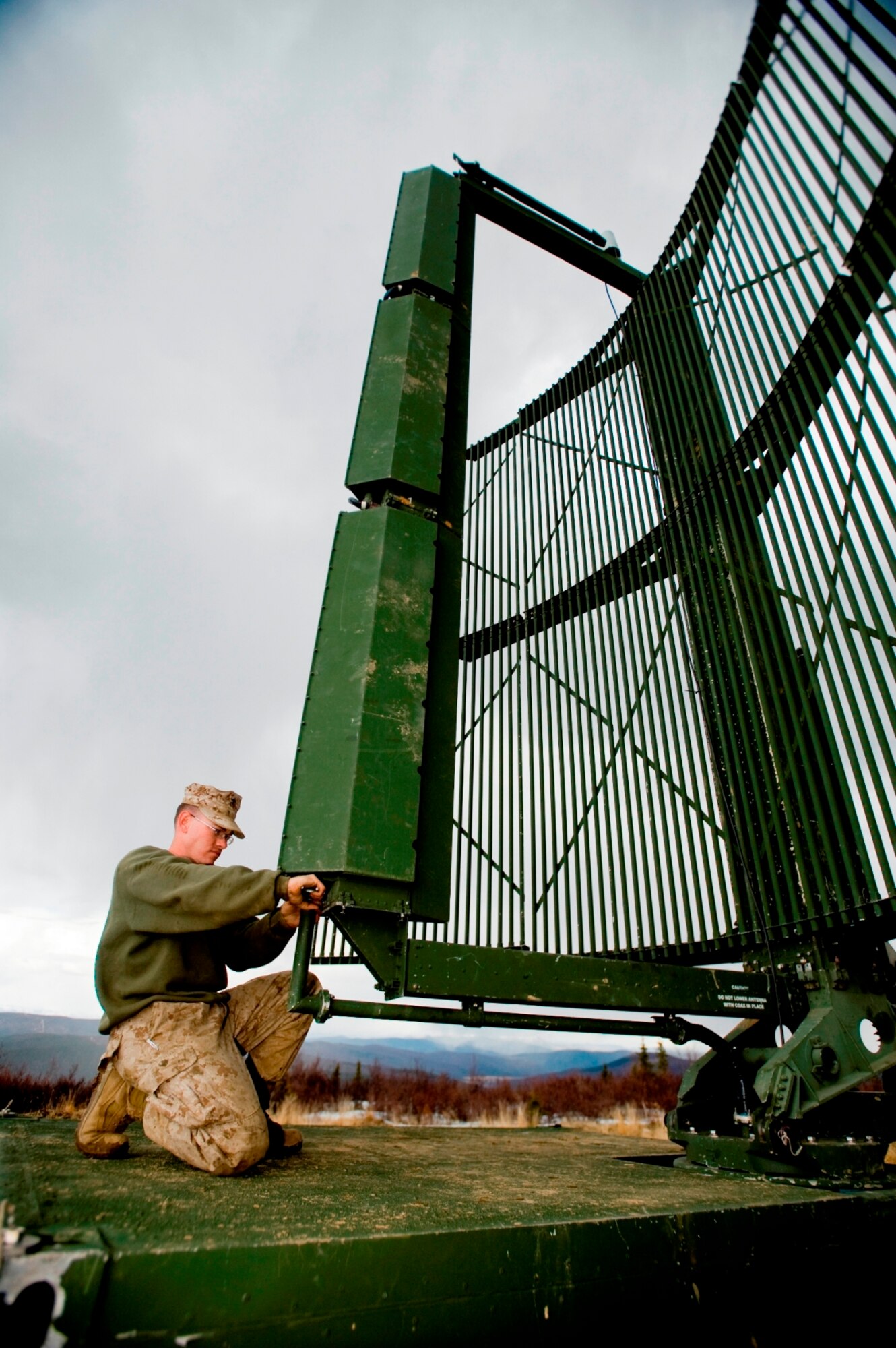 EIELSON AIR FORCE BASE, Alaska—Lance Corporal Trey Wilson Marine Air Control Squadron 4 tightens a transmission feed line to a radar dish at Eielson Air Force Base, Alaska on May 6, 2008. The Marine Air Control Squadron 4 is working with the Air Force to train on emerging joint tactics, techniques and procedures for the Northern Edge exercise. Northern Edge provides U.S. military units a cost effective and low risk training opportunity  for regional and world wide crises.(U.S. Air Force Photo by Airman 1st Class Jonathan Steffen) (RELEASED)