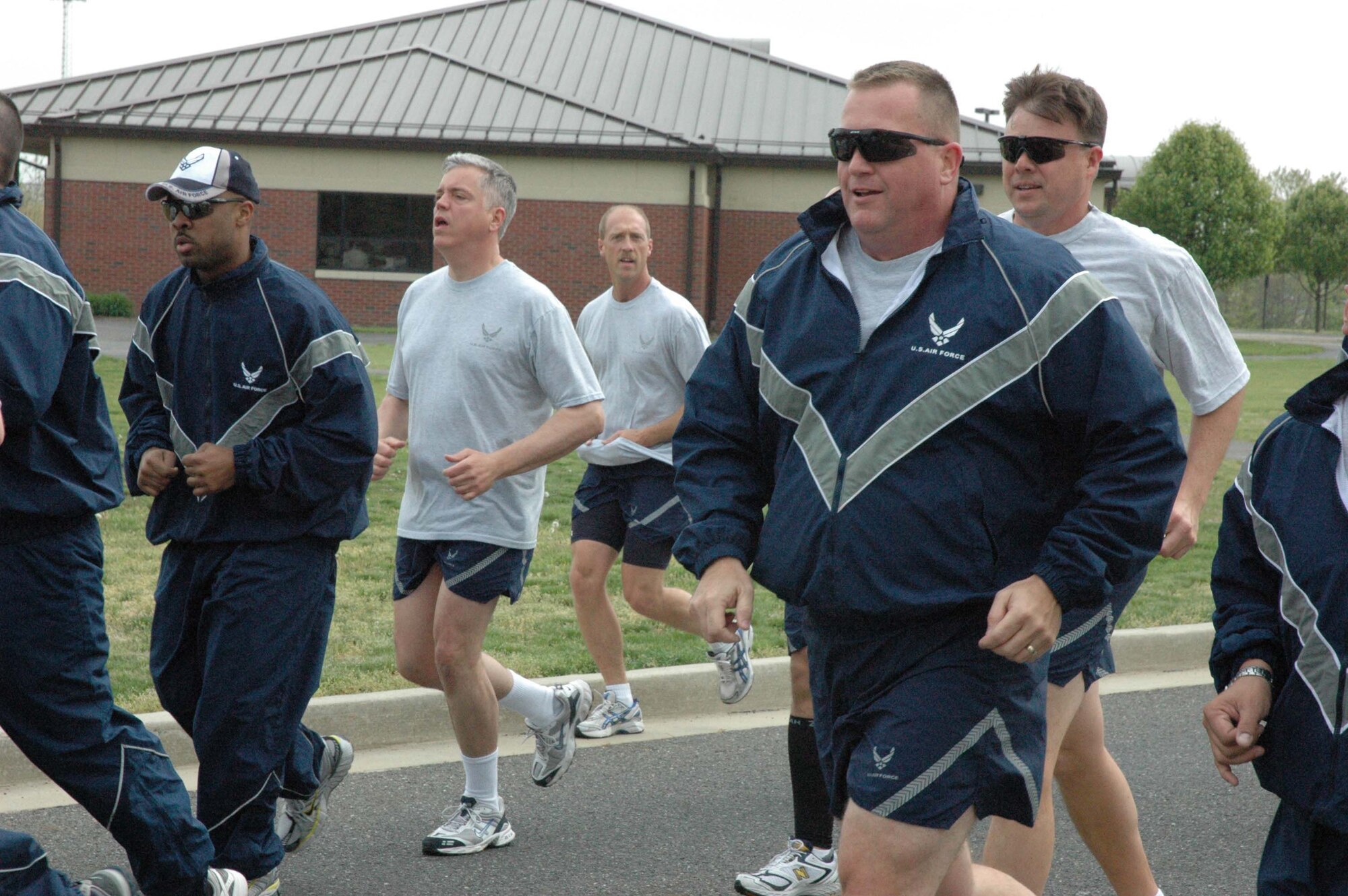MCGUIRE AIR FORCE BASE, NJ - Senior Master Sgt. Don Tillotson, first sergeant of the 88th Aerial Port Squadron, partakes in a fitness run at the end of a Reserve drill workday. The monthly run gives  514th Air Mobility Wing members an opportunity to sing cadence while exercising as a group. (U.S. Air Force photo/Senior Airman William P. O'Neil III)