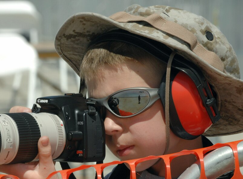 Daniel Thow, 9, photographs the U.S. Air Force Thunderbirds May 2 at AirFest 2008 at March Air Reserve Base, Calif.  Daniel has been a photographer since he was 6, but has been going to air shows with his father John since he was 4. (U.S. Air Force photo/Senior Airman Erica J. Knight)