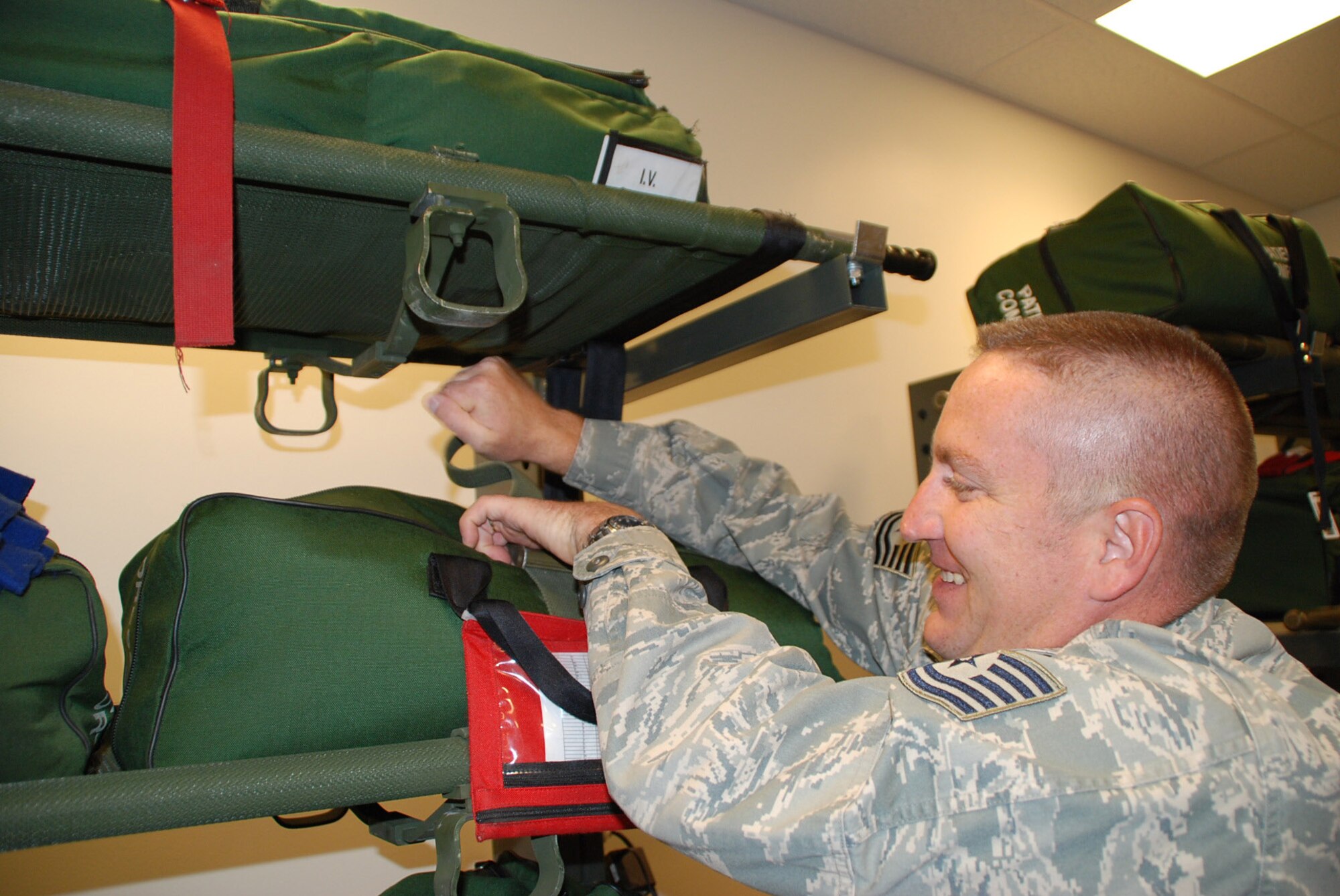 Tech Sgt. Christopher Pfaff, noncommissioned officer of medical logicstics at the 932nd Airlift Wing, spent time recently loading gear for a flying mission.  He has been in the 932nd since 1997 and has served over 17 years in the military.  Here he helps get gear packed up for other members to fly aboard a C-130.  He is part of the Air Force Reserve's 932nd Aeromedical Evacuation Squadron based at Scott Air Force Base.  Photo/Tech Sgt. Gerald Sonnenberg