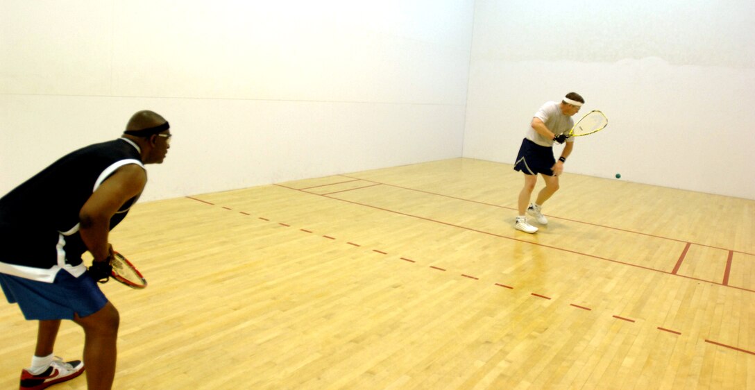 LANGLEY AIR FORCE BASE, Va. --  Cleveland Hall, and Col. Dennis Simpson from Air Combat Command Communications practice racquet ball after winning the intramural championships against Air Combat Command Operations March 28.  (U.S. Air Force photo/Senior Airman Christopher L. Ingersoll)