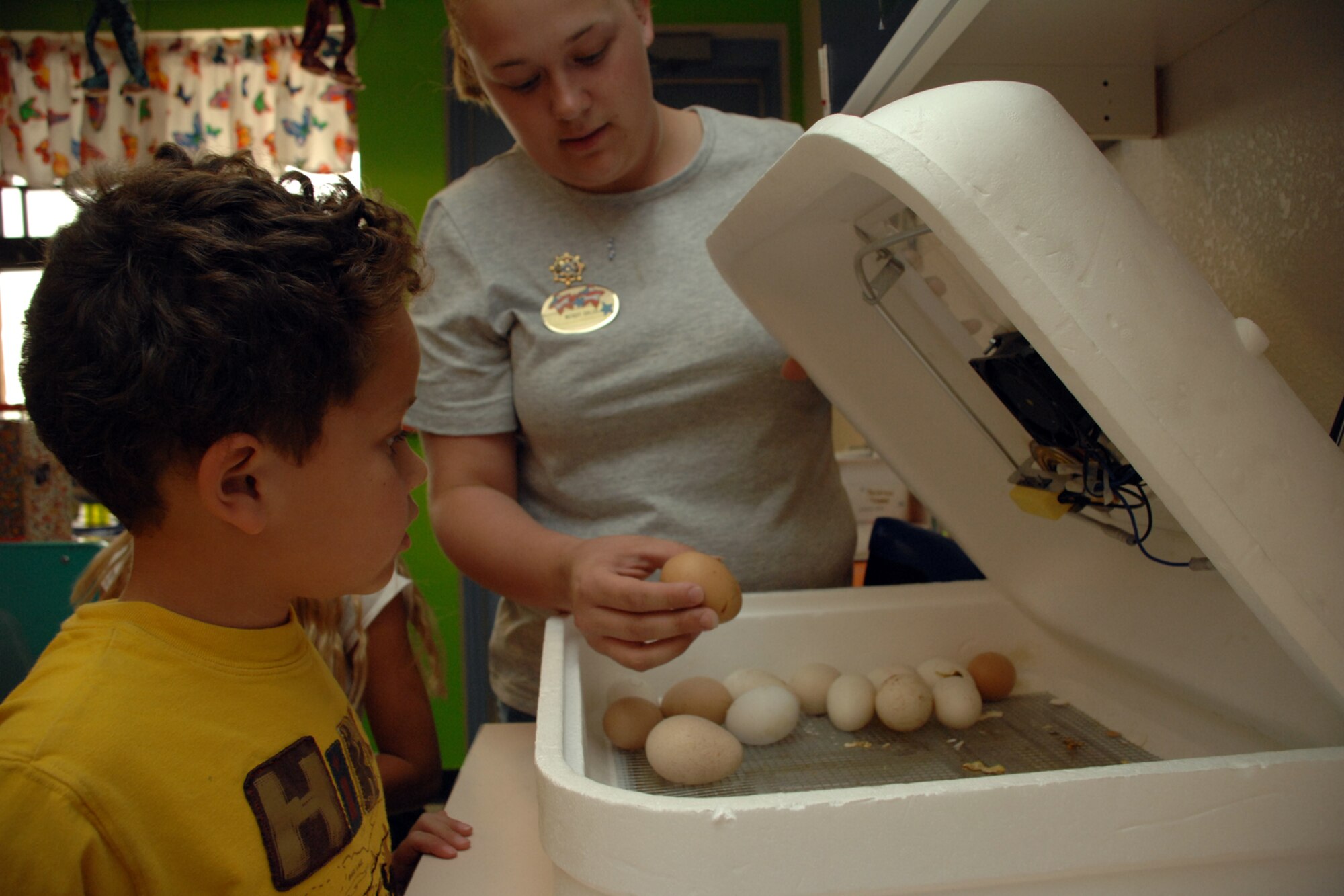 HOLLOMAN AIR FORCE BASE, N.M.--Wendy Galus, Holloman School Age Program assistant, explains how an incubator works. While in the incubator, eggs are turned four to six times a day to insure each side is heated evenly. (U.S. Air Force photo/Airman 1st Class Jamal D. Sutter)