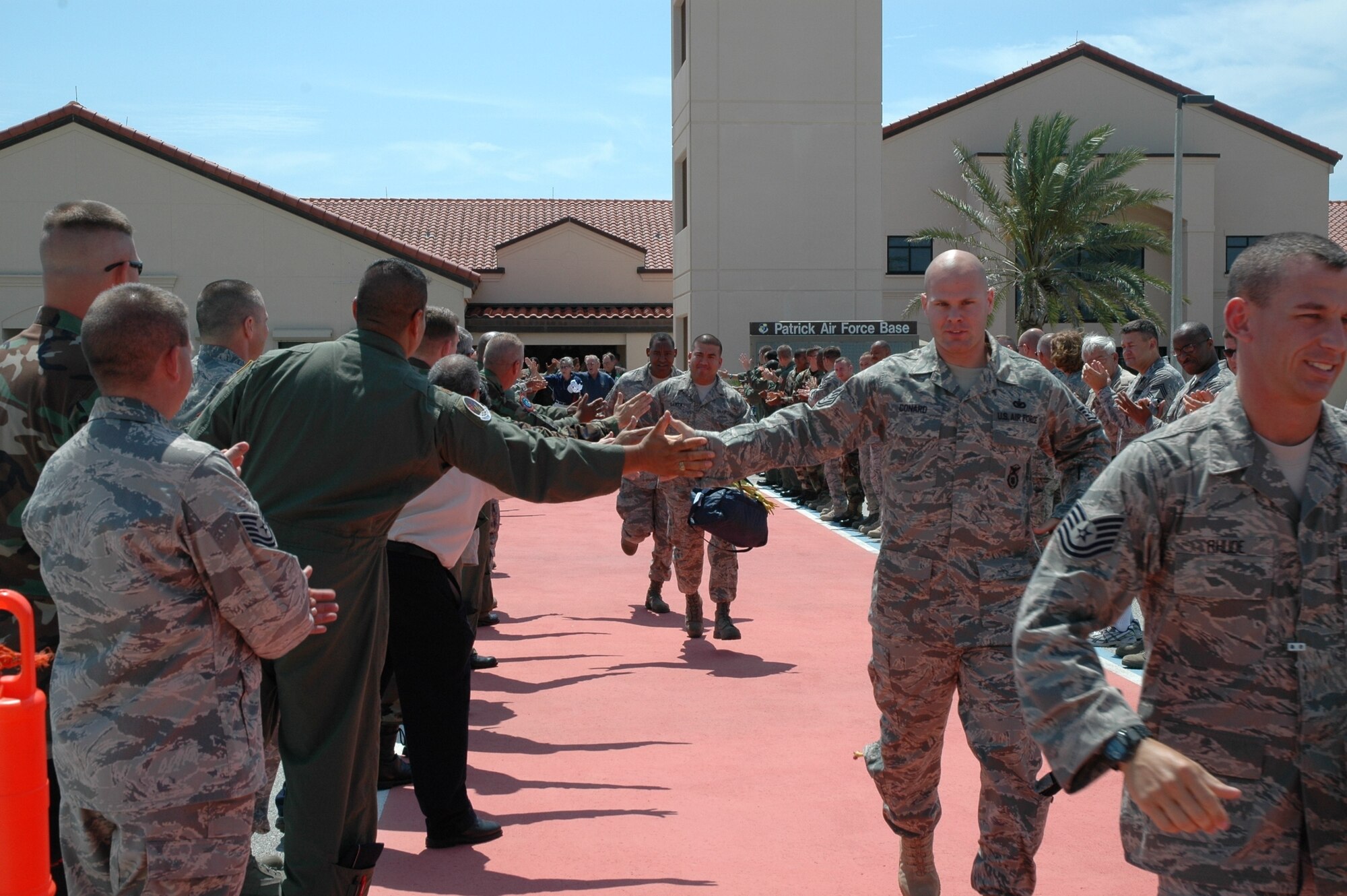 Members of the 45th Space Wing Guardian Challenge team are cheered as they make their way to the C-130 aircraft that will carry them to Peterson Air Force Base, Colo. for the Guardian Challenge awards ceremony May 7. (U.S. Air Force photo by Chris Calkins)