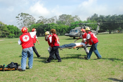 COMALAPA AIR BASE, El Salvador-Salvadoran rescue personnel retrieve ?injured? personnel from a Joint Task Force-Bravo Blackhawk helicopter May 6 during Fuerzas Aliadas Humanitarias 2008. The exercise provided JTF-Bravo pilots with familiarization of disaster relief efforts in the region. (U.S. Air Force photo by Tech. Sgt. William Farrow)