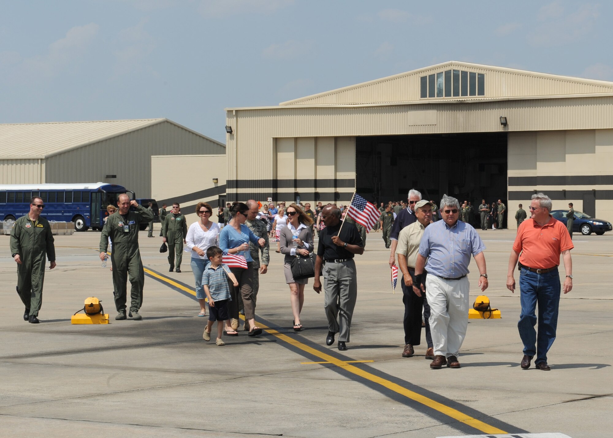 SEYMOUR JOHNSON AIR FORCE BASE, N.C. - Base leadership along with community leaders and family members of the 335th Fighter Squadron walk to greet pilots from the 335th FS May 7. The pilots were deployed in support of Operation Enduring Freedom. (U.S. Air Force photo by Airman 1st Class Ciara Wymbs)