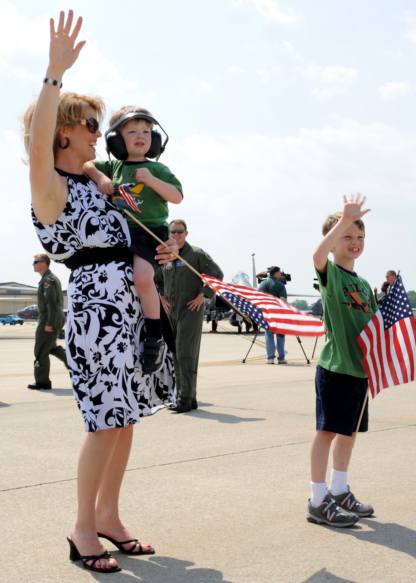 SEYMOUR JOHNSON AIR FORCE BASE, N.C. - Jenny Collins stands with her two sons, Hunter, 7, and Logan, 3, while they wave to their father, Captain Lewis Collins, 335th Fighter Squadron, May 7. Captain Collins returned from a four month deployment supporting Operation Enduring Freedom. (US Air Force photo by Airman First Class Salma Nebot)
