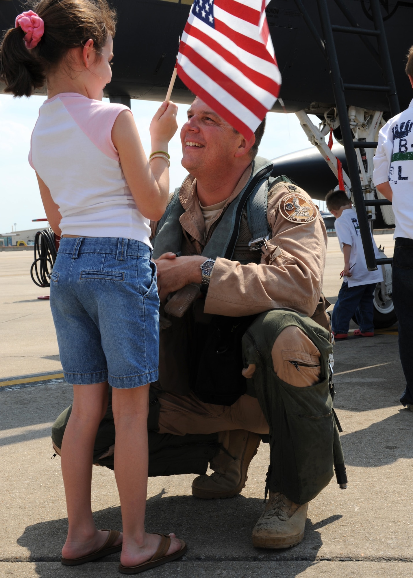 SEYMOUR JOHNSON AIR FORCE BASE, N.C. - Lieutenant Colonel James G. Jinnette, 335th Fighter Squadron commander, is greeted by his daughter, Hannah Jinnette, after returning from a four month deployment, May 7.    Lt Col Jinnette led the 335th Expeditionary Fighter Squadron in support of Operation Enduring Freedom. (US Air Force photo by Airman First Class Salma Nebot)