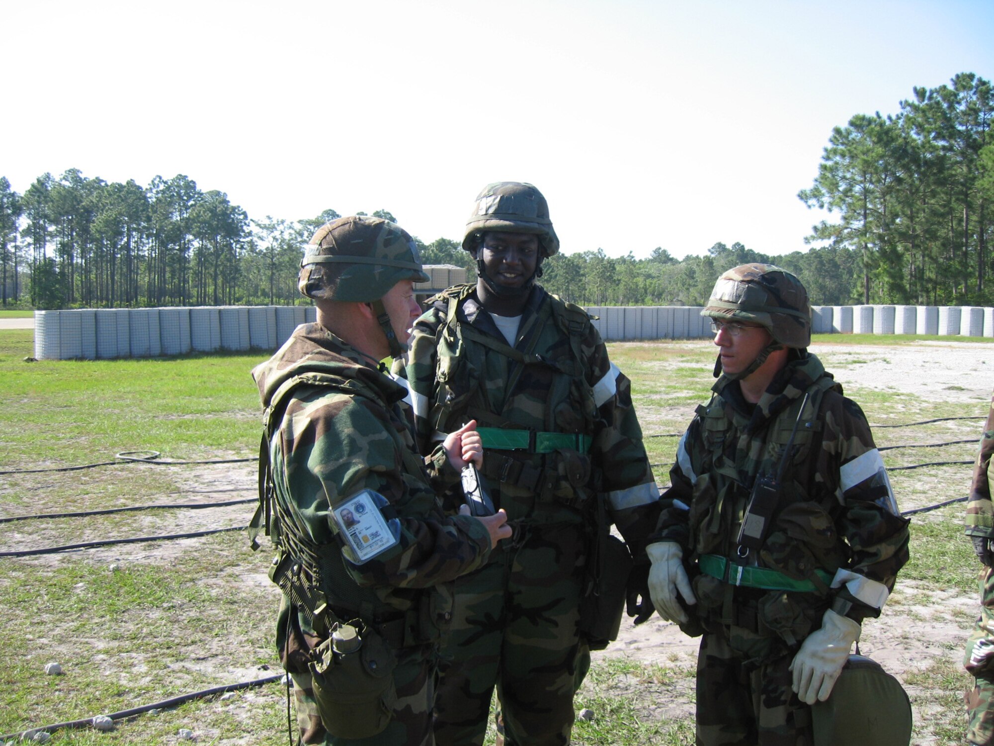 SEYMOUR JOHNSON AIR FORCE BASE, N.C. -- Senior Master Sgt. George Role, Staff Sgt. Kevin Williams and Tech. Sgt. Sean Hughes discuss defensive tactics during Silver Flag Training at Tyndall Air Force Base, Fla.  Nineteen reservists from the 916th Civil Engineer Squadron participated in the exercise, which hones wartime civil engineer skills in a bare base environment. The members returned to Seymour Johnson in early May.