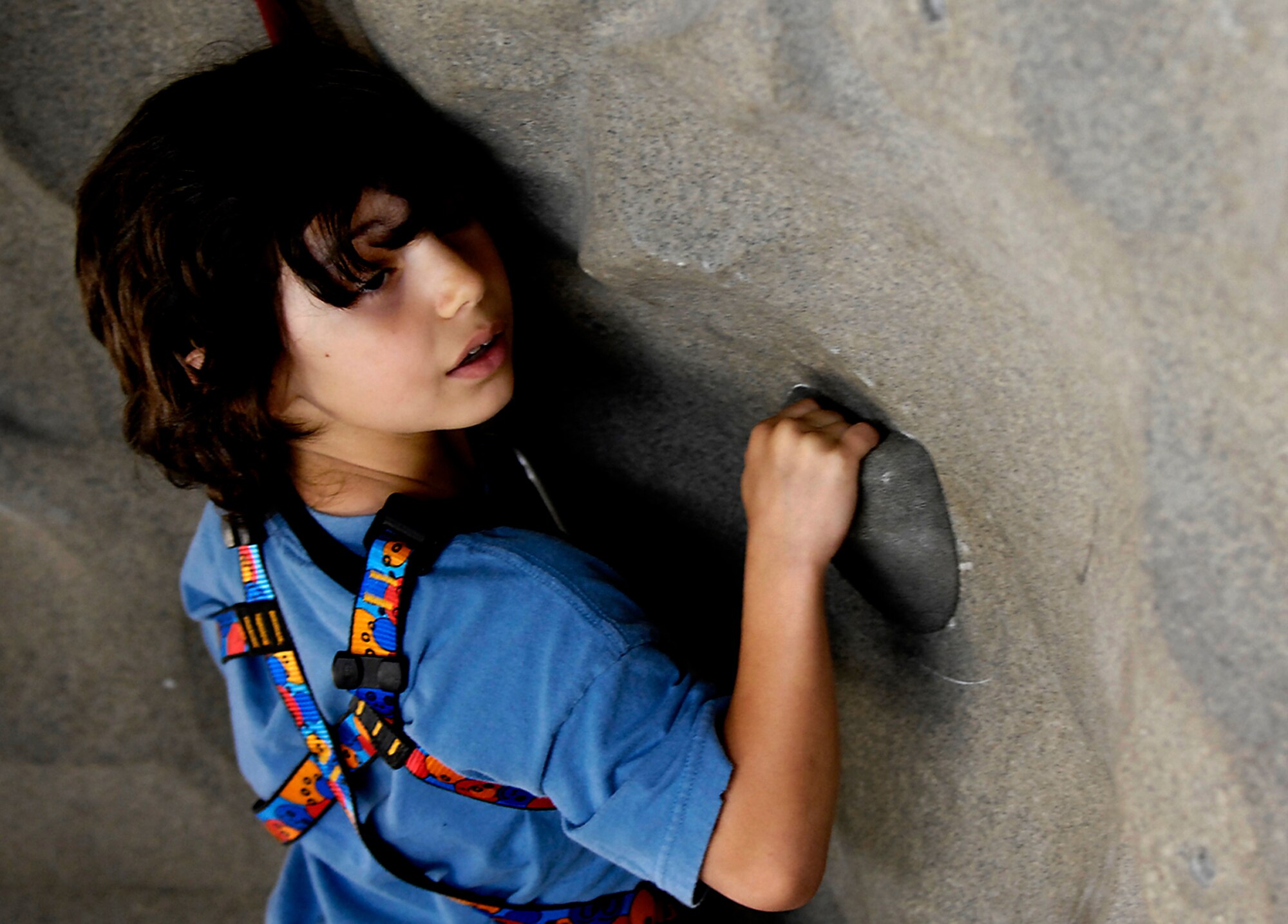 Jared Arredondo climbs the simulated rock wall at the Outdoor Recreational Center on Charleston AFB May 7. Base members are allowed to pay to use the facilities at the ORC during the hours of 8 a.m. to 5 p.m. Monday through Friday. Jared, 7, is the son of Tech. Sgt. Mark and Staff Sergeant Jennifer Arrendondo. (U.S. Air Force photo/Staff Sgt. Joshua DeMotts)