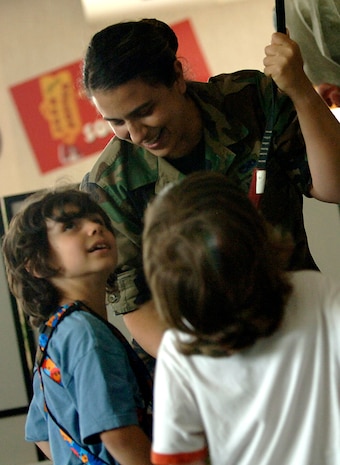 After finishing the rock wall Jared Arredondo talks with his mother Staff Sgt. Jennifer Arrendondo and brother Alex about completing the climb at the Outdoor Recreational Center on Charleston AFB May 7. Jared, 7, is the son of Tech. Sgt. Mark and SSgt Jennifer Arrendondo. (U.S. Air Force photo/Senior Airman Nicholas Pilch)