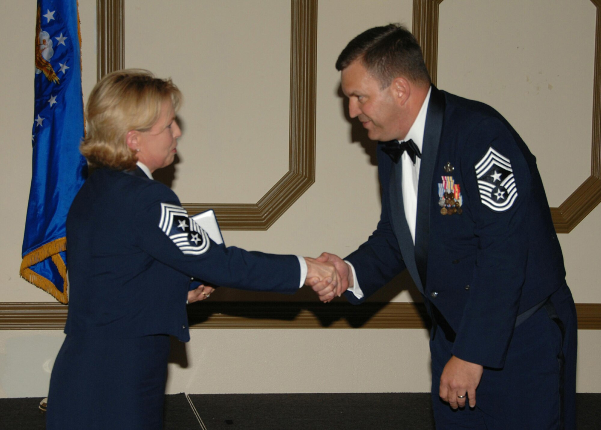 SEYMOUR JOHNSON AIR FORCE BASE, N.C. -- 916th Air Refueling Wing Command Chief Lester Boltinhouse thanks 4th Air Force Command Chief Patricia Thornton for her participation in the wing's annual NCO Recognition Ceremony.  U.S. Air Force photo/TSgt. Gillian Albro