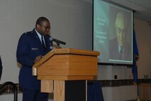 MINOT AIR FORCE BASE, N.D. -- Lt. Col. Robert Payne, 741st Missile Squadron director of operations, reads an excerpt from the book "An Unbroken Chain" by Henry Oertelt during the Holocaust Days of Remembrance luncheon held here April 29. During the luncheon, passages written by authors who survived the Holocaust were read by children from Memorial Middle School and Airmen from the base. (U.S. Air Force photo by Senior Airman Cassandra Jones)