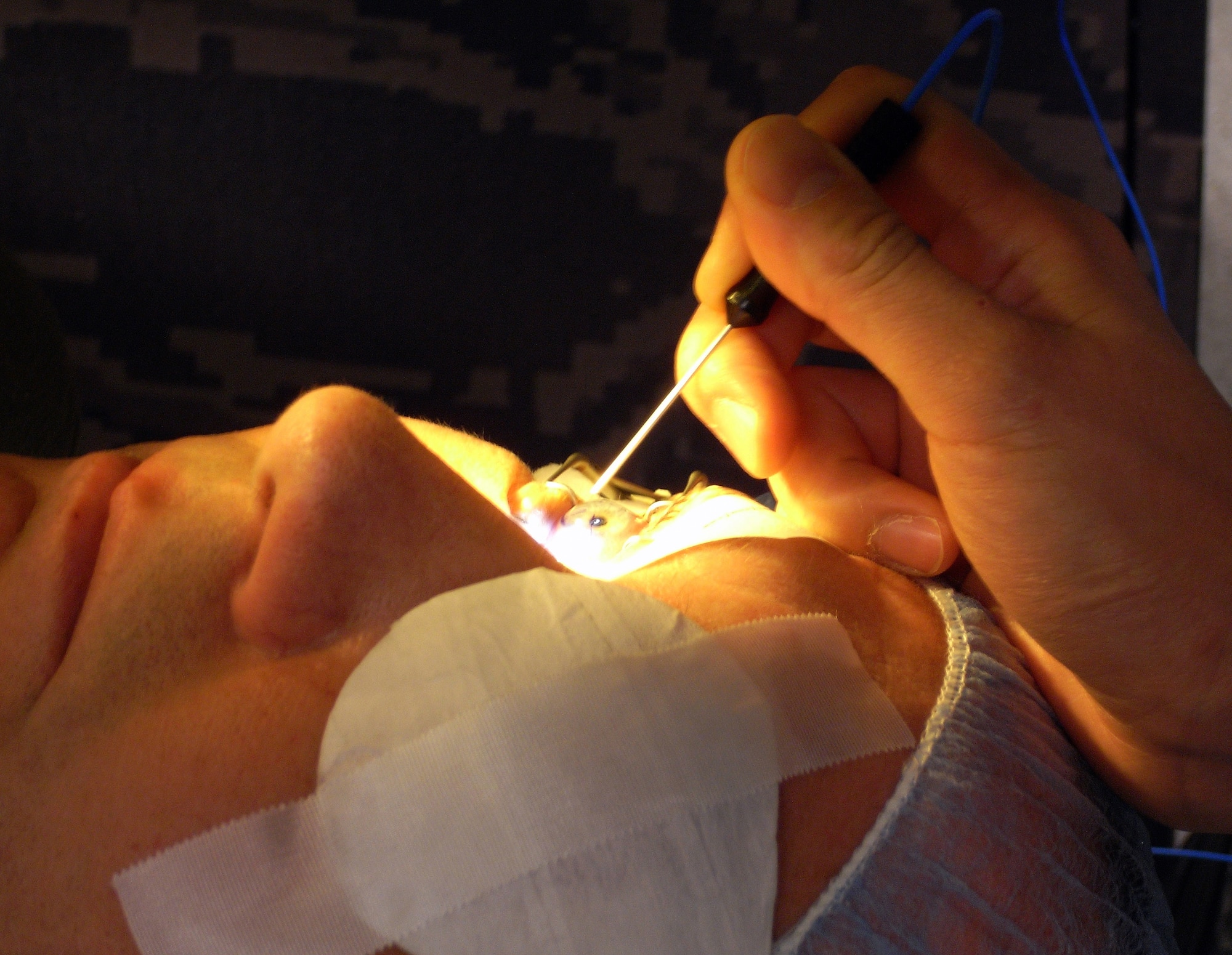 A patient's eye is prepared for photorefractive keratectomy at the Joint Warfighter Refractive Surgery Center, Lackland Air Force Base, Texas, on March 26.  Corrective eye surgery is avaliable to all qualified active duty personnel. (U.S. Air Force photo/Master Sgt. Kimberly A. Yearyean-Siers)                                  