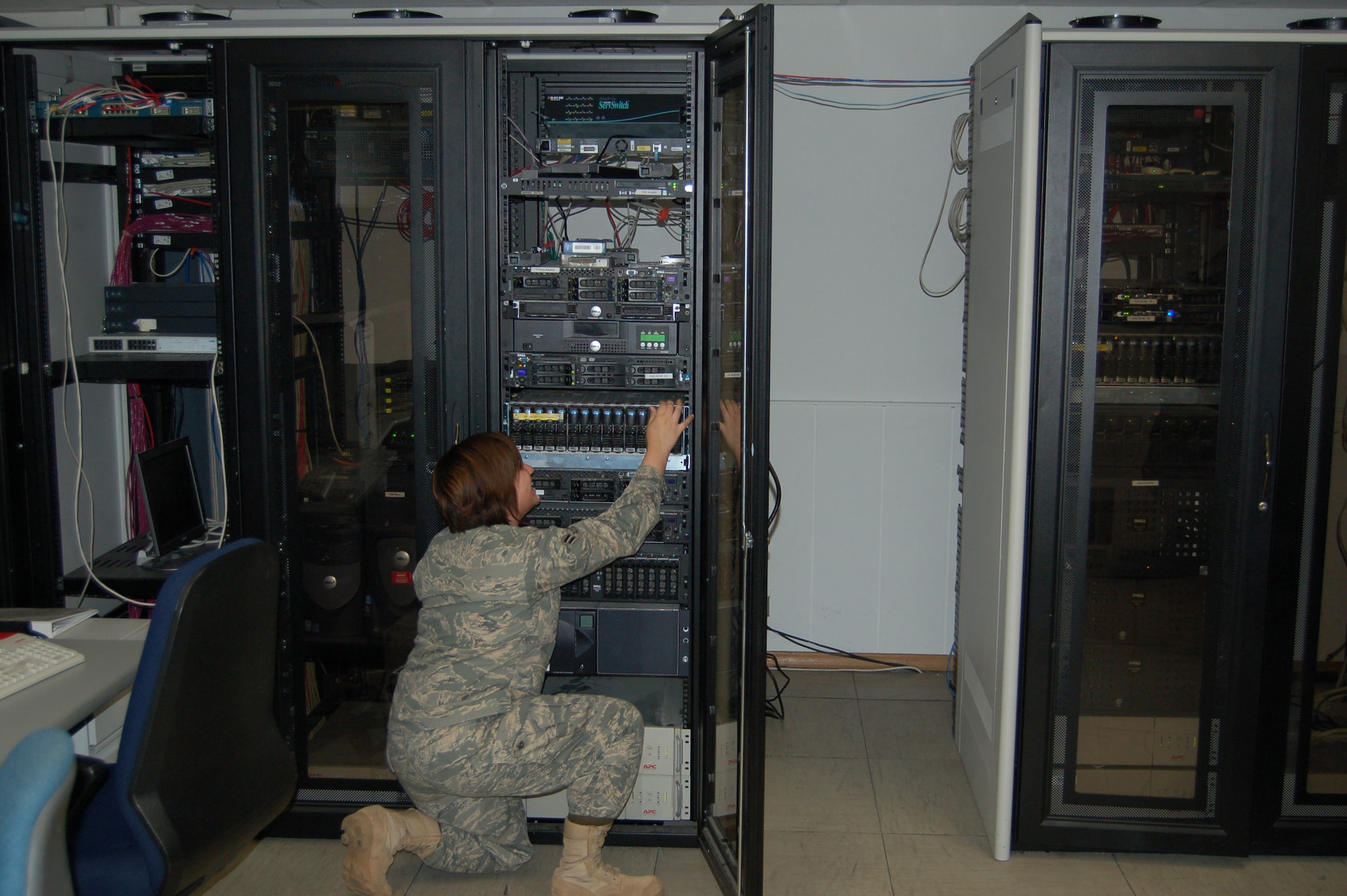 Airman 1st Class Jessica Arroyo, 1st Air and Space Communications Operations Squadron, checks hardware on the TBMCS-UL servers.(Courtesy Photo)