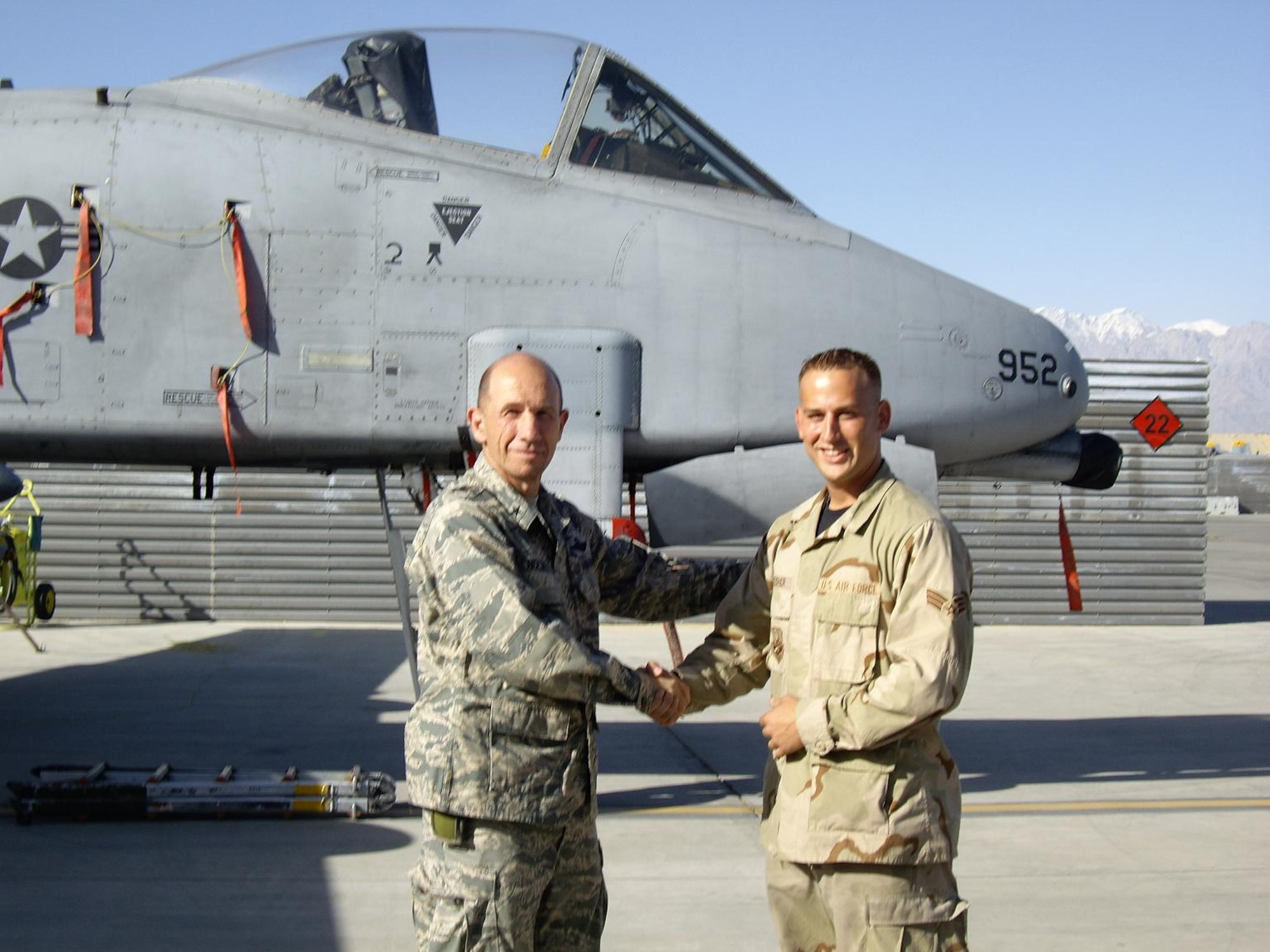 BAGRAM AIR BASE, Afghanistan -- Senior Airman Robert W. Deisher, A-10 crew chief, was recently coined by the 455th Air Expeditionary Wing commander, Brig. Gen. James M. Holmes, for his outstanding support of Operation Enduring Freedom during his tour here.  Airman Deisher is deployed from Spangdahlem Air Base, Germany. (Courtesy photo)